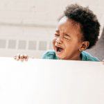 child crying in kitchen