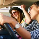women singing in the car